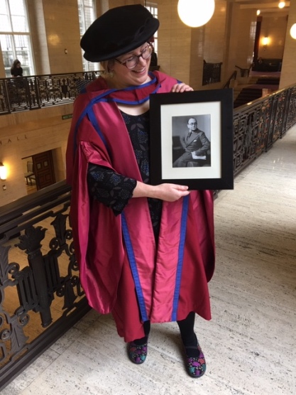 Lucie with picture of Maurice Elvey at her PhD graduation